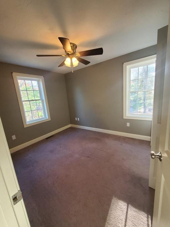 carpeted empty room with ceiling fan