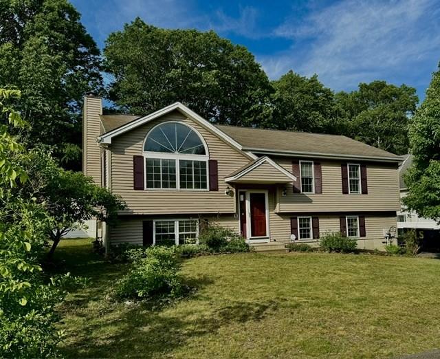 62 Moreland Green Dr, Worcester, MA 01609 - split foyer home with a chimney and a front yard