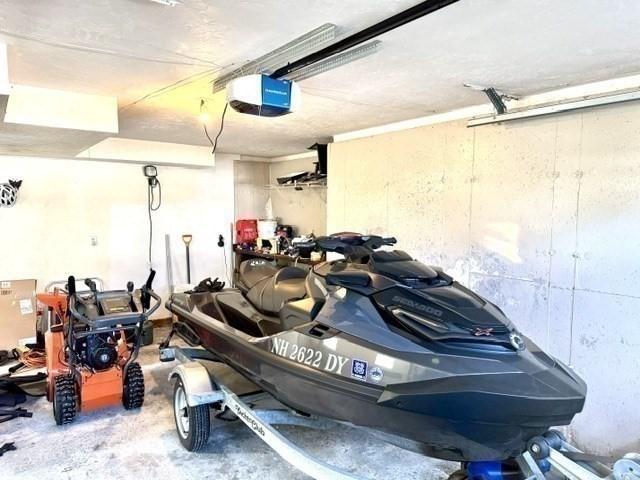 62 Moreland Green Dr, Worcester, MA 01609 - garage featuring a garage door opener