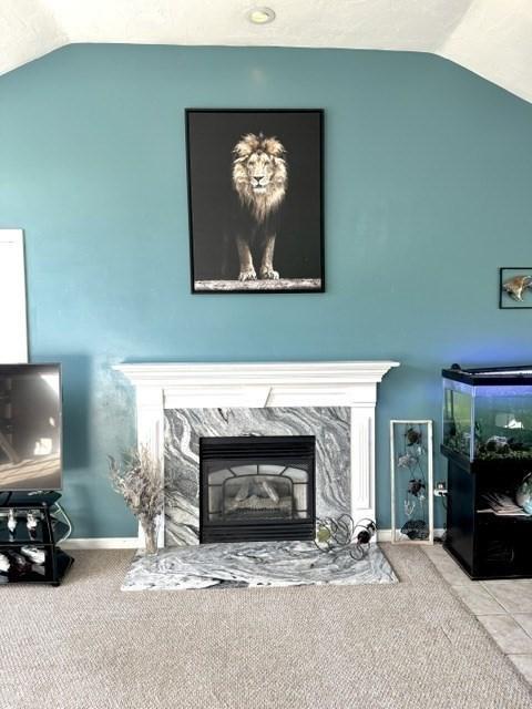 62 Moreland Green Dr, Worcester, MA 01609 - carpeted living area featuring vaulted ceiling, a fireplace, and baseboards