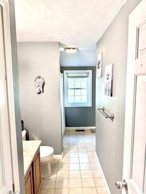62 Moreland Green Dr, Worcester, MA 01609 - bathroom with vanity, toilet, tile patterned floors, baseboards, and a shower with shower curtain
