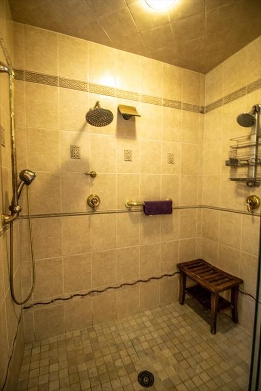 bathroom with a tile shower