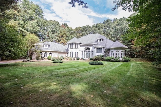 view of front of property with french doors and a front yard