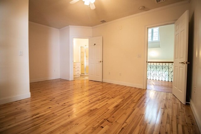 unfurnished room with ornamental molding, ceiling fan, and light wood-type flooring