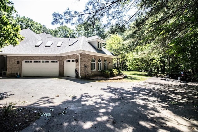 view of side of property featuring a garage