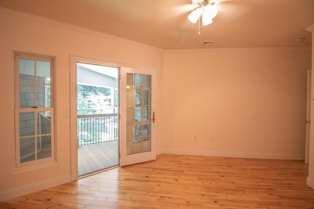 entryway with ceiling fan, ornamental molding, and light wood-type flooring