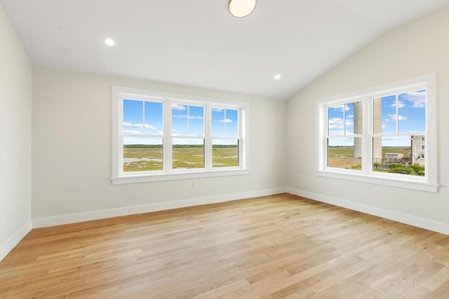 77 N End Blvd Unit 2, Salisbury, MA 01952 - spare room featuring plenty of natural light, light wood-type flooring, vaulted ceiling, and recessed lighting