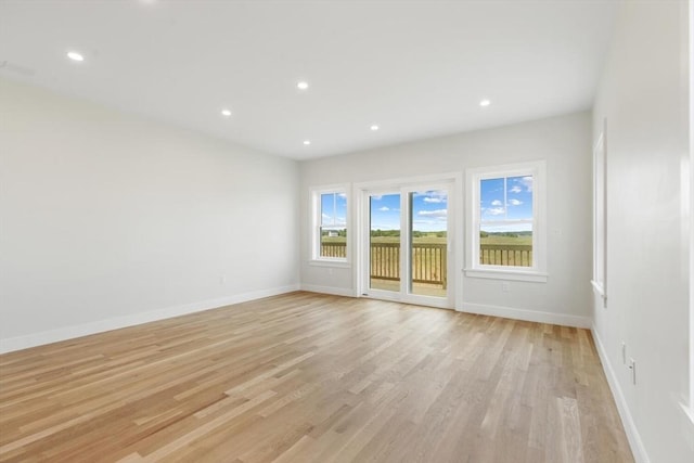 77 N End Blvd Unit 2, Salisbury, MA 01952 - empty room featuring light wood finished floors, baseboards, and recessed lighting