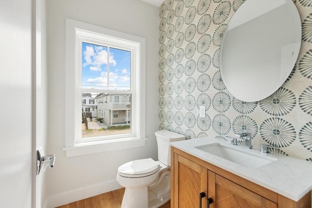 77 N End Blvd Unit 2, Salisbury, MA 01952 - bathroom featuring toilet, vanity, wood finished floors, and baseboards
