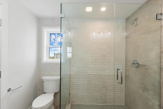 77 N End Blvd Unit 2, Salisbury, MA 01952 - bathroom featuring toilet, a shower stall, and tile patterned flooring