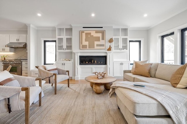 832 E 3rd Unit A, Boston, MA 02127 - living room with recessed lighting, ornamental molding, light wood finished floors, and a glass covered fireplace