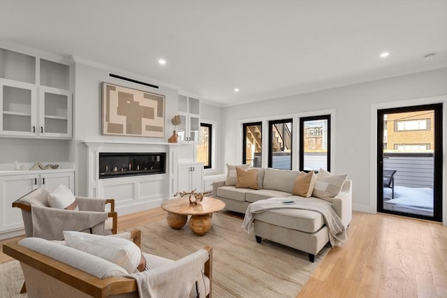 832 E 3rd Unit A, Boston, MA 02127 - living room with ornamental molding, light wood-style flooring, recessed lighting, and a glass covered fireplace