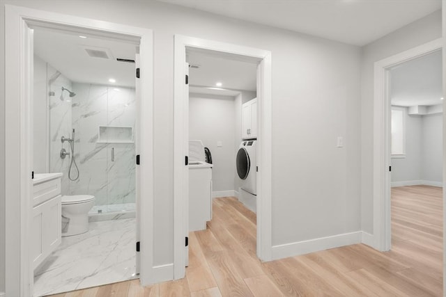 832 E 3rd Unit A, Boston, MA 02127 - bathroom with a marble finish shower, recessed lighting, wood finished floors, and washer / clothes dryer