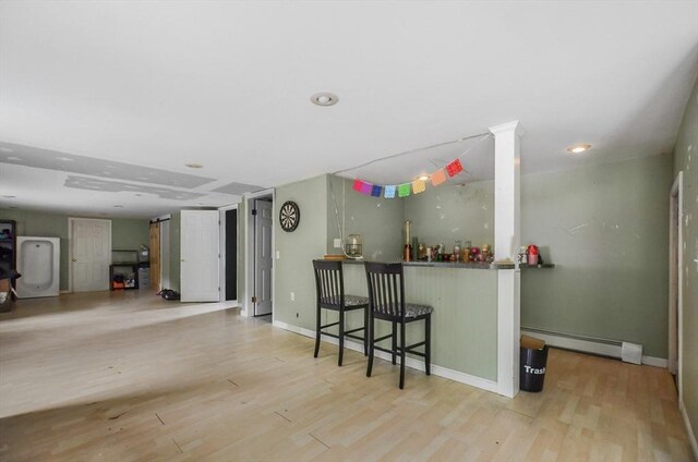 249 Chace Rd, Freetown, MA 02717 - bar area with a baseboard radiator, wood finished floors, and baseboards