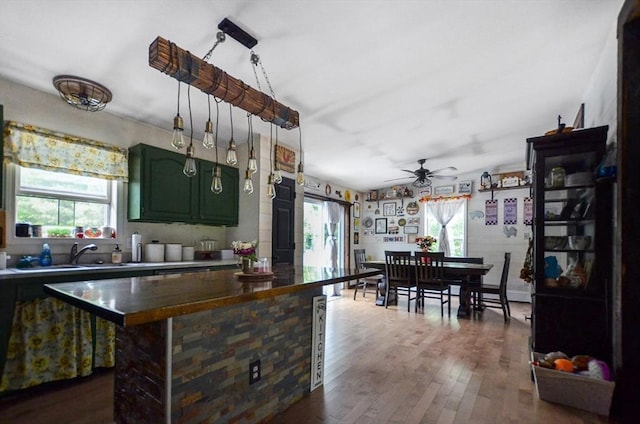 249 Chace Rd, Freetown, MA 02717 - kitchen featuring plenty of natural light, green cabinetry, a sink, and a ceiling fan