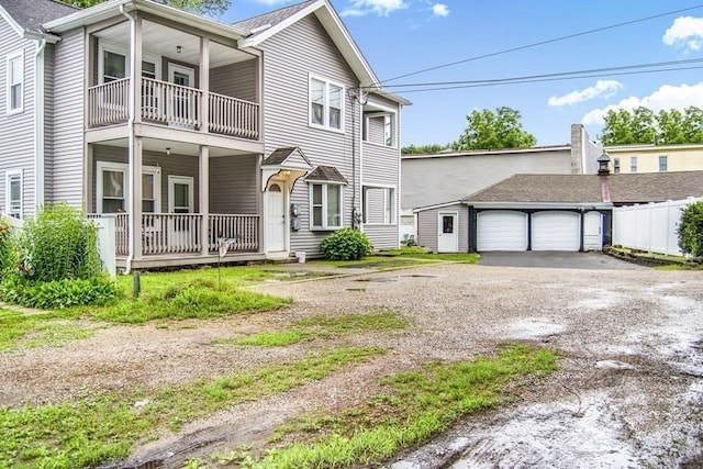 view of front of property with covered porch and a garage