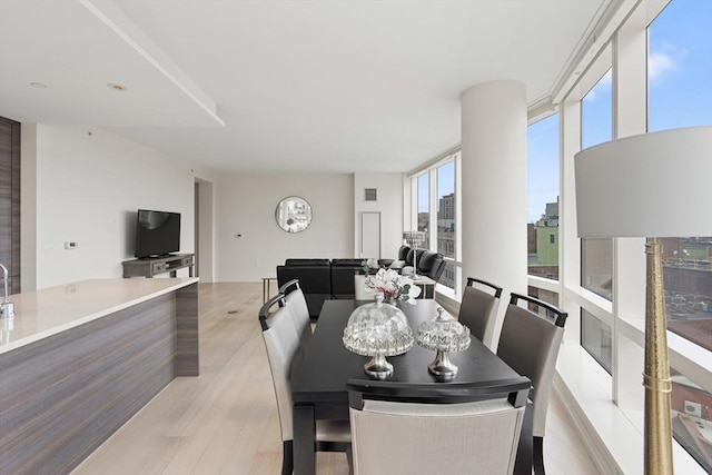 1 Franklin St Unit 1504, Boston, MA 02110 - dining room featuring light wood-style floors
