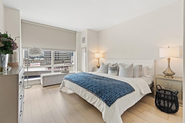 1 Franklin St Unit 1504, Boston, MA 02110 - bedroom featuring light wood-style flooring