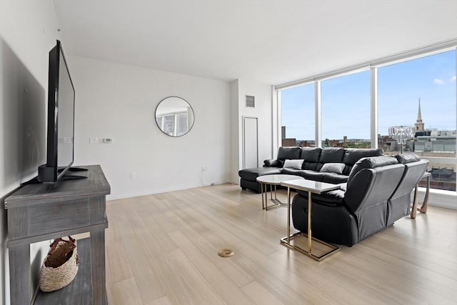 1 Franklin St Unit 1504, Boston, MA 02110 - living area with light wood-style floors and a wall of windows