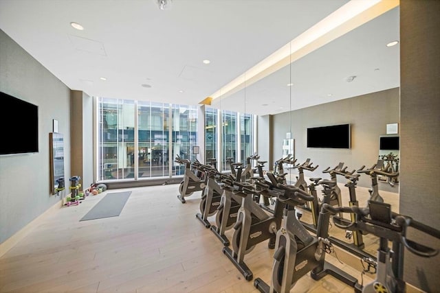 1 Franklin St Unit 1504, Boston, MA 02110 - workout area featuring a wall of windows, light wood-style floors, and recessed lighting