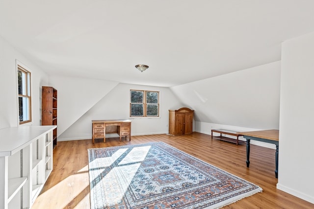 bonus room featuring hardwood / wood-style floors and vaulted ceiling