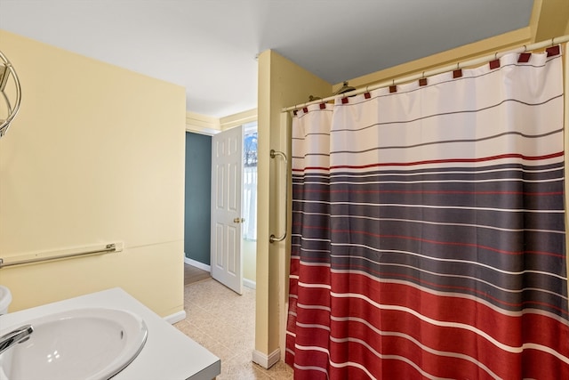 bathroom with tile patterned flooring and vanity