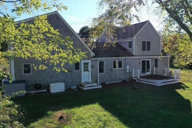 rear view of house with a yard