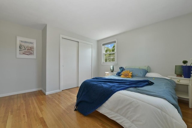 8 Edwards Rd Unit 8A, Woburn, MA 01801 - bedroom featuring light wood-style flooring, a closet, and baseboards
