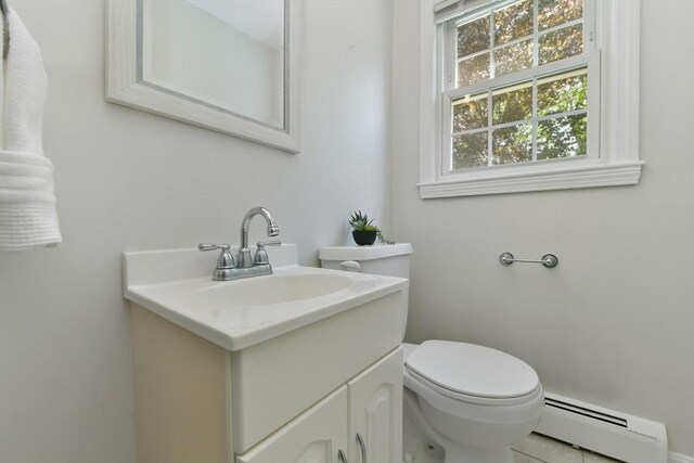 8 Edwards Rd Unit 8A, Woburn, MA 01801 - bathroom with a baseboard radiator, toilet, and vanity