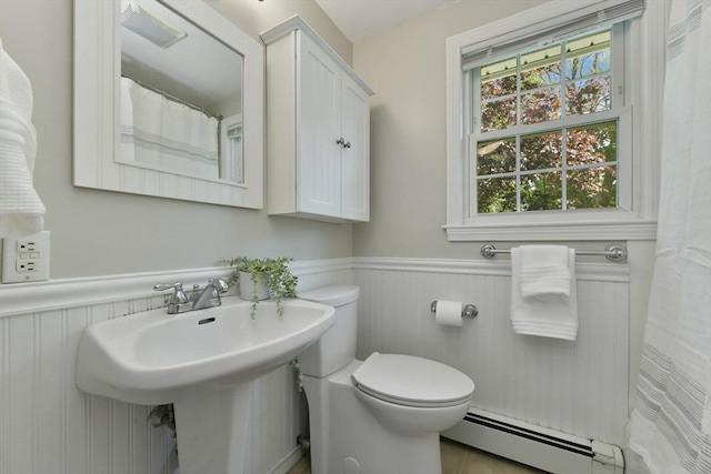 8 Edwards Rd Unit 8A, Woburn, MA 01801 - full bath with baseboard heating, wainscoting, toilet, and a sink