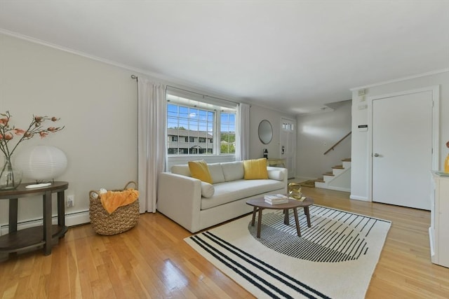 8 Edwards Rd Unit 8A, Woburn, MA 01801 - living room featuring light wood-style floors, stairway, crown molding, and a baseboard radiator