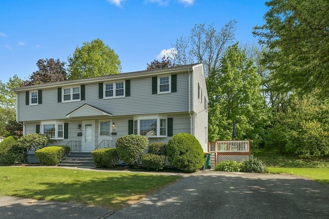 8 Edwards Rd Unit 8A, Woburn, MA 01801 - colonial-style house featuring a front yard and a deck