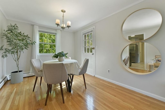 8 Edwards Rd Unit 8A, Woburn, MA 01801 - dining area with ornamental molding, a chandelier, light wood-style flooring, baseboards, and baseboard heating