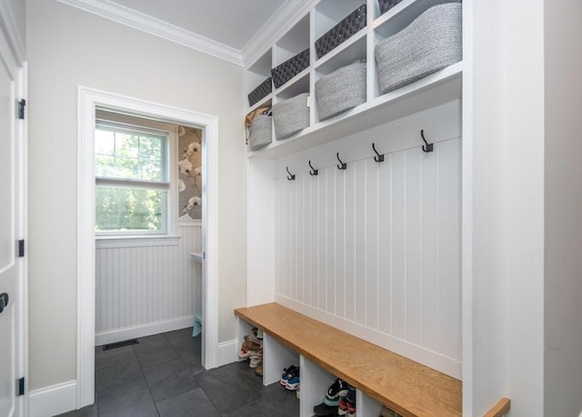 17 Elinor Cir, Waltham, MA 02452 - mudroom with ornamental molding, baseboards, and dark tile patterned floors