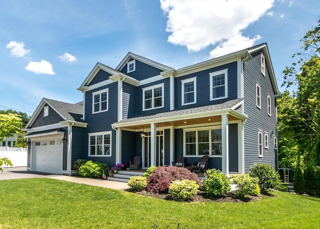 17 Elinor Cir, Waltham, MA 02452 - view of front of home featuring a porch, a front lawn, asphalt driveway, and a garage
