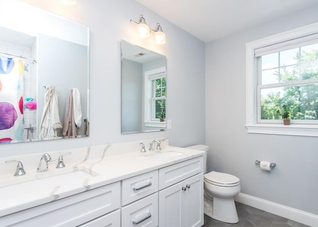 17 Elinor Cir, Waltham, MA 02452 - full bathroom featuring double vanity, toilet, baseboards, tile patterned floors, and curtained shower