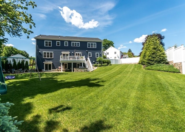 17 Elinor Cir, Waltham, MA 02452 - back of house with stairway and a wooden deck