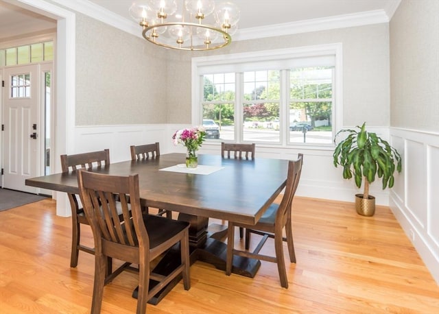 17 Elinor Cir, Waltham, MA 02452 - dining room featuring a chandelier, light wood finished floors, wainscoting, crown molding, and a decorative wall