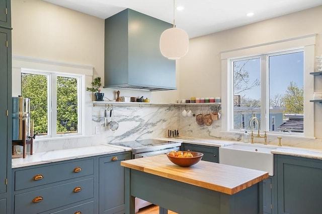 bar featuring recessed lighting, wall chimney exhaust hood, stainless steel electric range, a sink, and backsplash