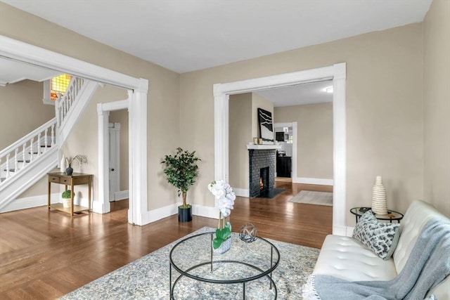 living room with a fireplace and hardwood / wood-style flooring