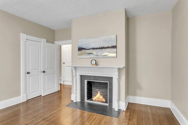 unfurnished living room with hardwood / wood-style floors