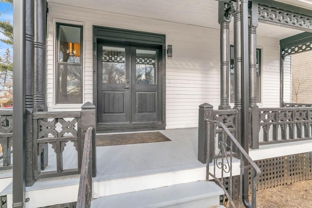 doorway to property featuring a porch