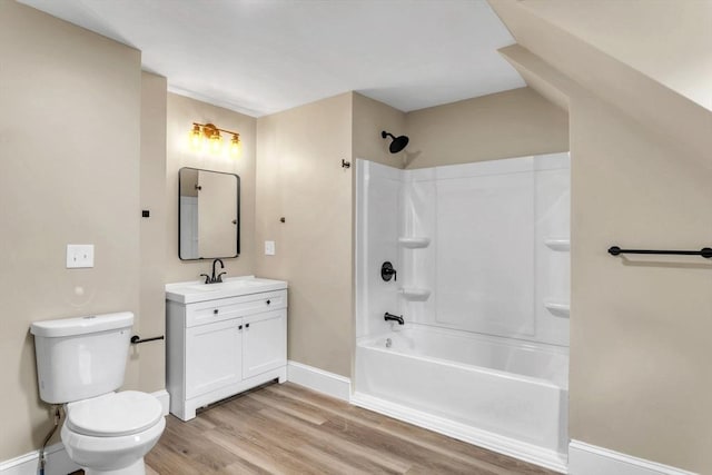 full bathroom featuring shower / tub combination, toilet, vanity, and hardwood / wood-style flooring