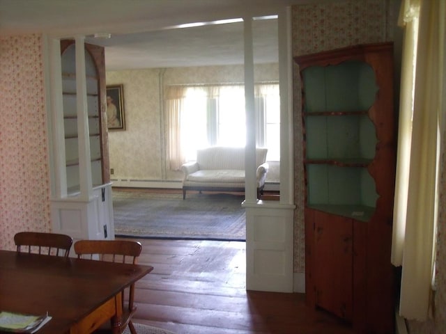 2 N St, Williamsburg, MA 01096 - dining space with wallpapered walls, hardwood / wood-style flooring, and a baseboard radiator