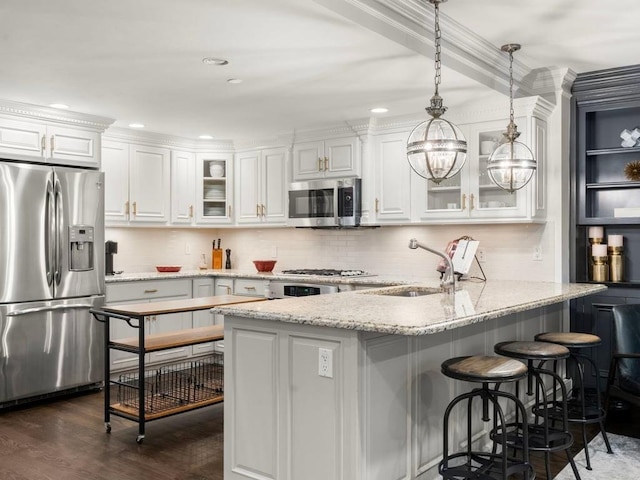 115 Sewall Ave Unit 1, Brookline, MA 02446 - kitchen with stainless steel appliances, white cabinets, a peninsula, glass insert cabinets, and recessed lighting