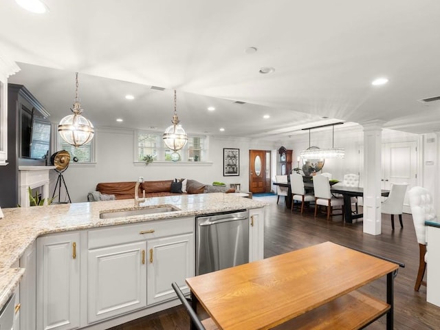115 Sewall Ave Unit 1, Brookline, MA 02446 - kitchen with stainless steel dishwasher, recessed lighting, light stone countertops, dark wood-style flooring, and hanging light fixtures