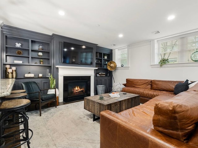 115 Sewall Ave Unit 1, Brookline, MA 02446 - living area with a fireplace with flush hearth, recessed lighting, and light wood finished floors