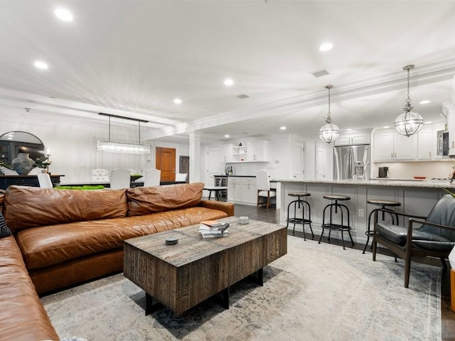 115 Sewall Ave Unit 1, Brookline, MA 02446 - living area with recessed lighting, ornamental molding, and ornate columns