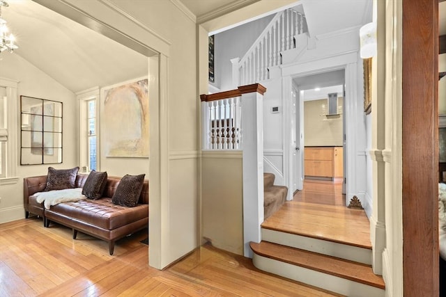 26 Saxon Rd, Newton, MA 02461 - hallway with stairway, light wood-type flooring, vaulted ceiling, and ornamental molding