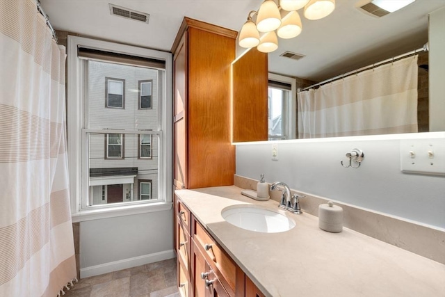 10 Peters Unit 2, Boston, MA 02127 - full bathroom with vanity, baseboards, and curtained shower